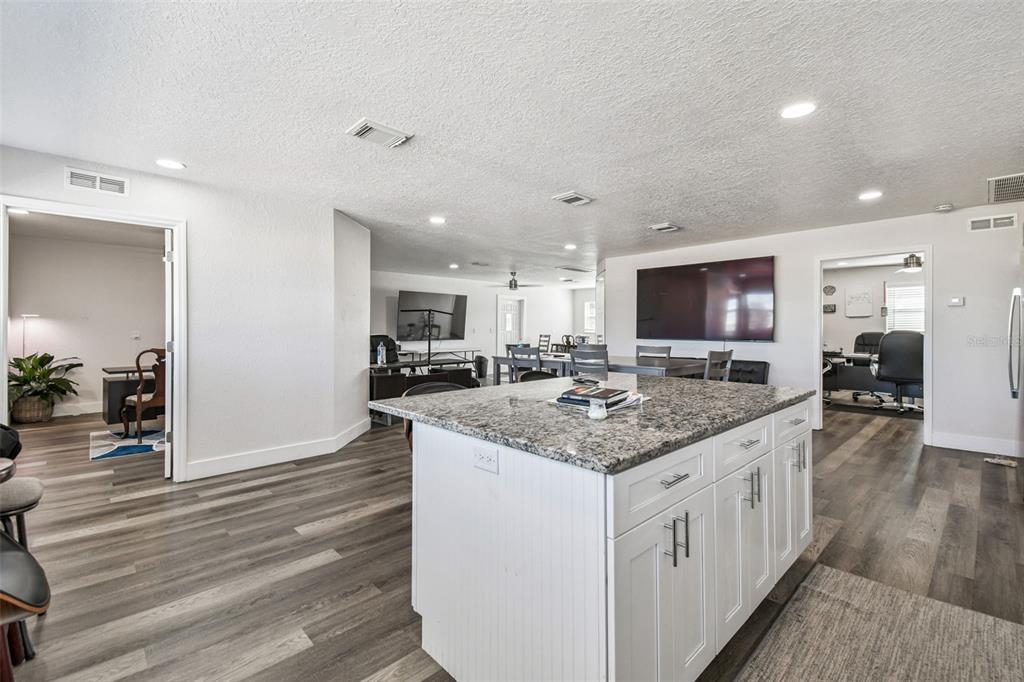 6010 Wall Street Port Richey, FL 34668 - Photo 18 of 43 a kitchen with a sink and a wooden floor