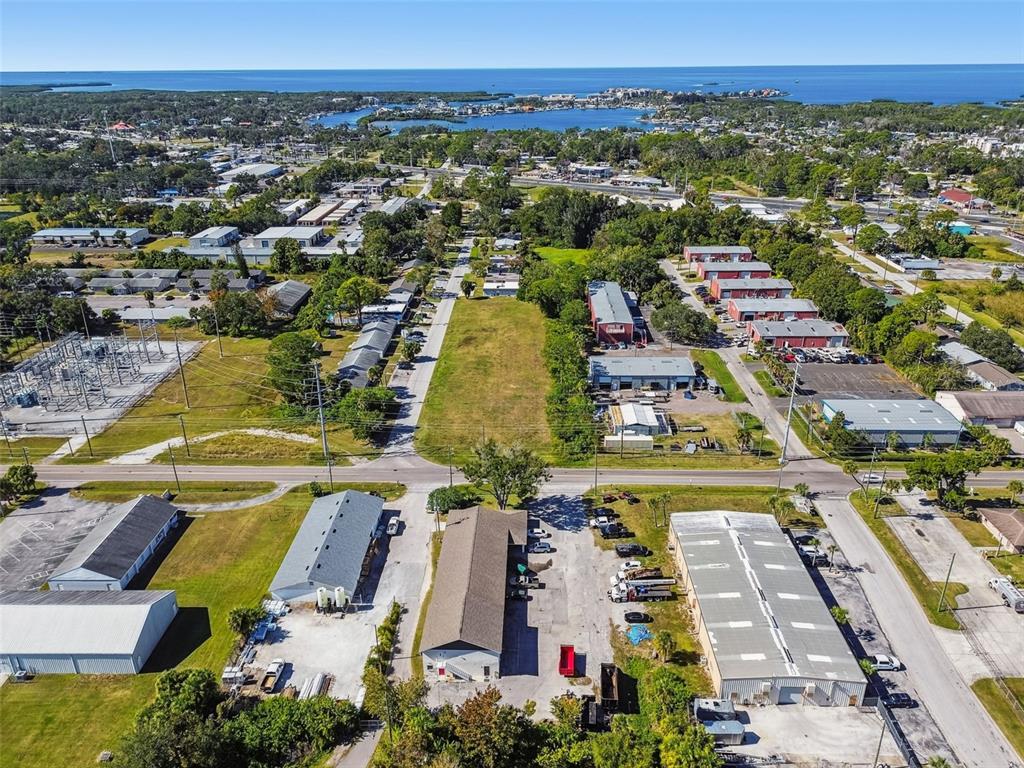 6010 Wall Street Port Richey, FL 34668 - Photo 2 of 43 an aerial view of residential houses with outdoor space