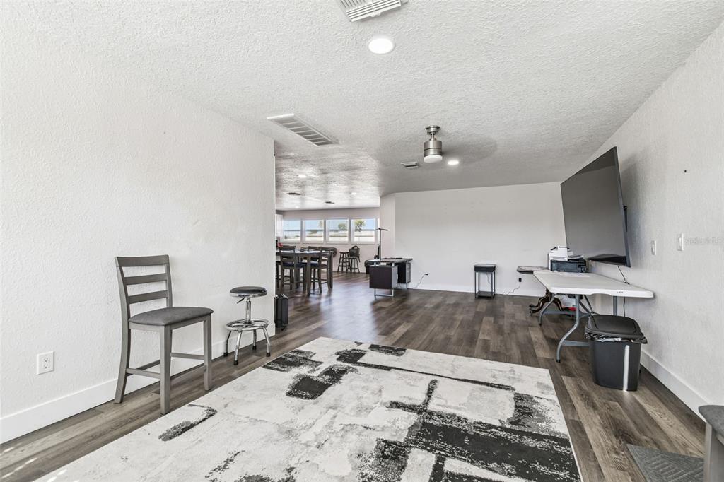 6010 Wall Street Port Richey, FL 34668 - Photo 25 of 43 a living room with furniture and a flat screen tv