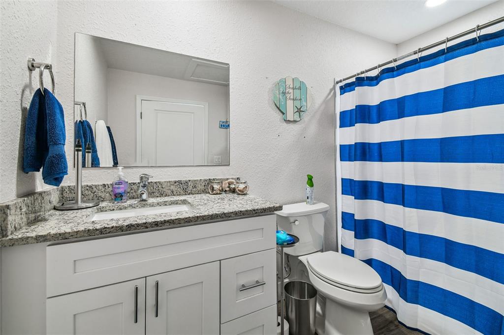 6010 Wall Street Port Richey, FL 34668 - Photo 26 of 43 a bathroom with a sink and a mirror