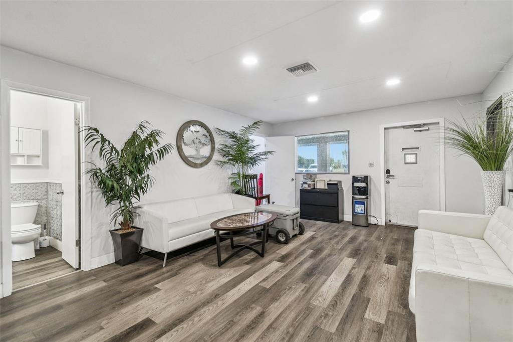 6010 Wall Street Port Richey, FL 34668 - Photo 34 of 43 a living room with furniture a clock on wall and a window
