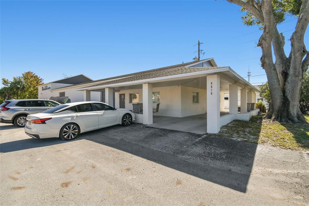 6010 Wall Street Port Richey, FL 34668 - Photo 5 of 43 a view of a car park in front of house