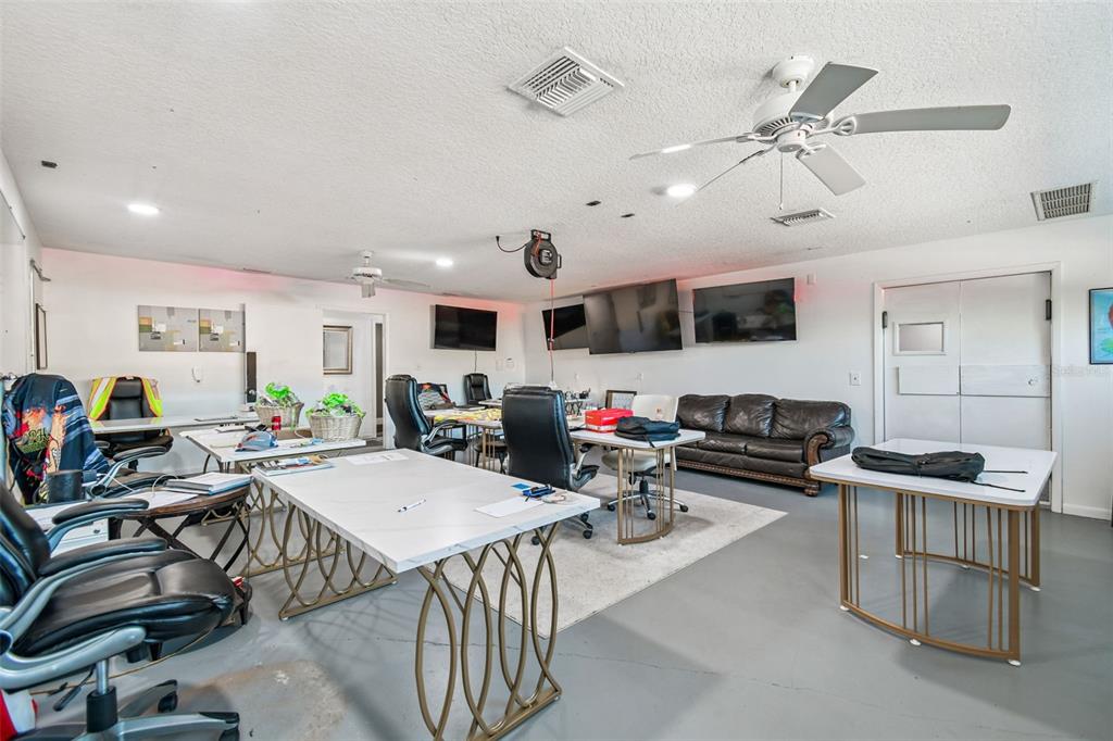 6010 Wall Street Port Richey, FL 34668 - Photo 9 of 43 a living room with furniture and a flat screen tv