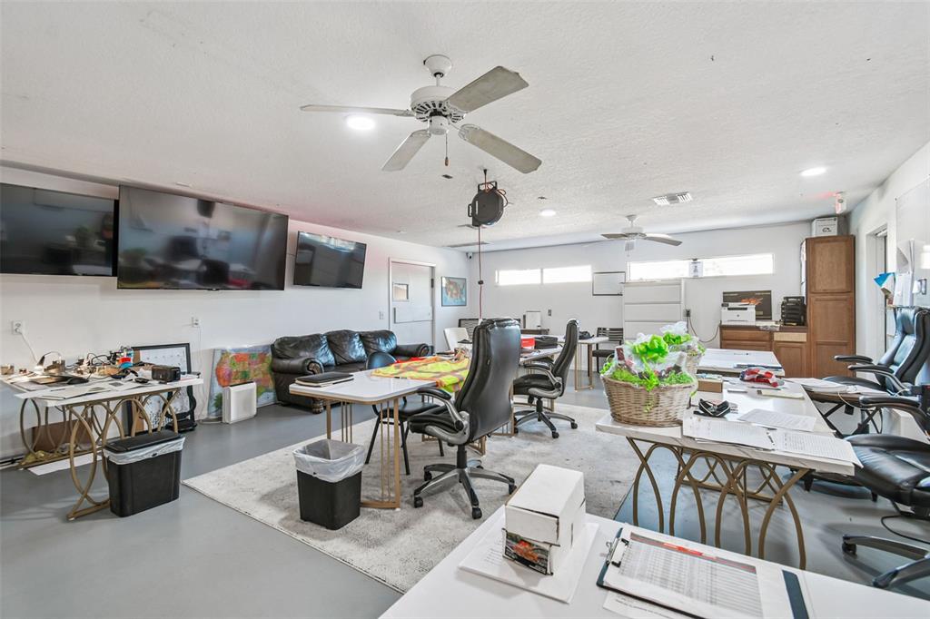 6010 Wall Street Port Richey, FL 34668 - Photo 10 of 43 a kitchen with a table and chairs