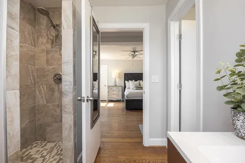 a en suite bathroom with a sink and a mirror