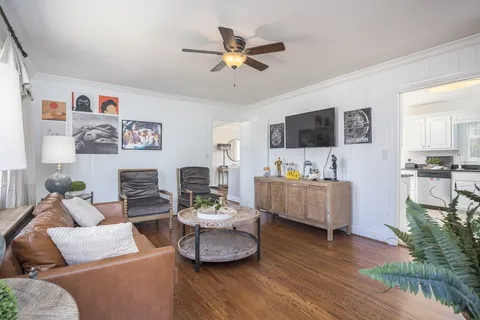 a living room with furniture and a flat screen tv