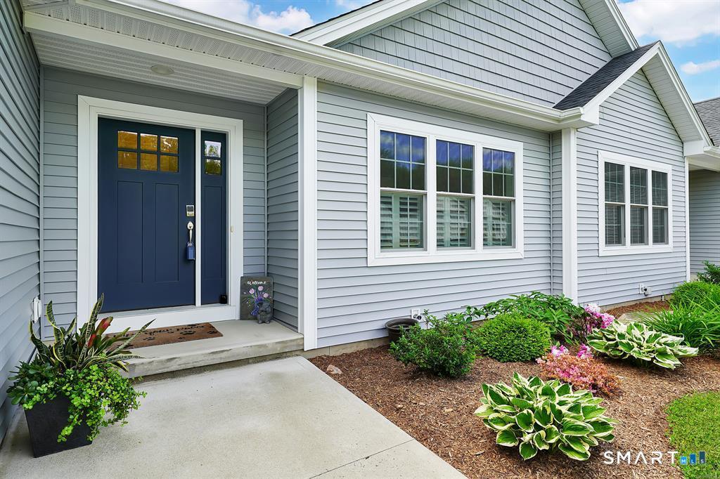 31 Eleanor Road, Unit 31 Somers, CT 06071 - Photo 3 of 42 a front view of a house with garden