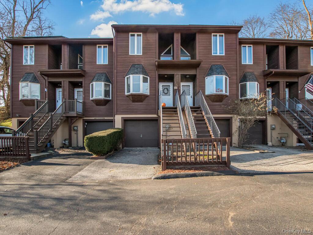 8 Davids Lane Ossining, NY 10562 - Photo 1 of 26 View of front of house with driveway, a garage, and stairway