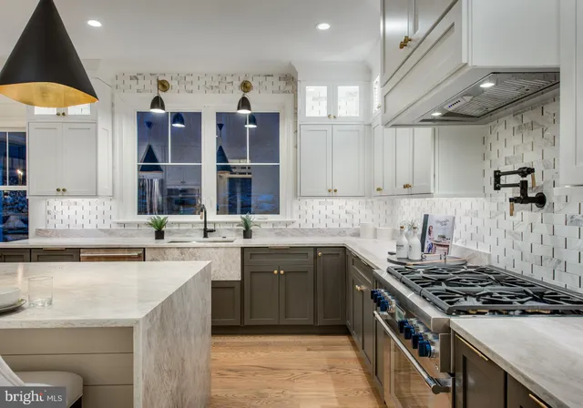 a kitchen with a sink stove and cabinets