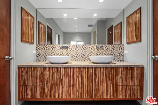 a white bath tub sitting in a bathroom