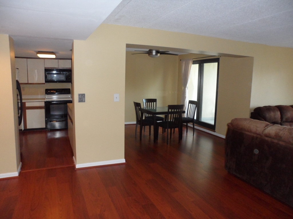 a livingroom with furniture wooden floor and windows