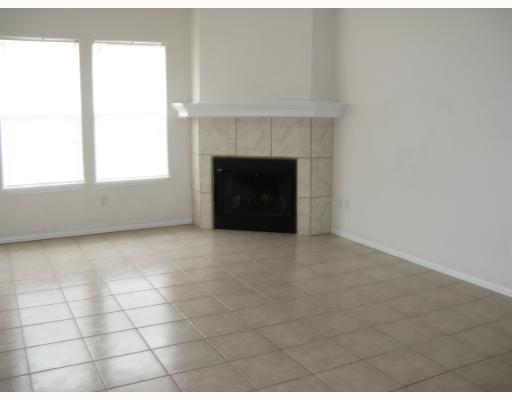 15514 Cruiser Street, Unit B Corpus Christi, TX 78418 - Photo 2 of 10 a view of an empty room with a fireplace