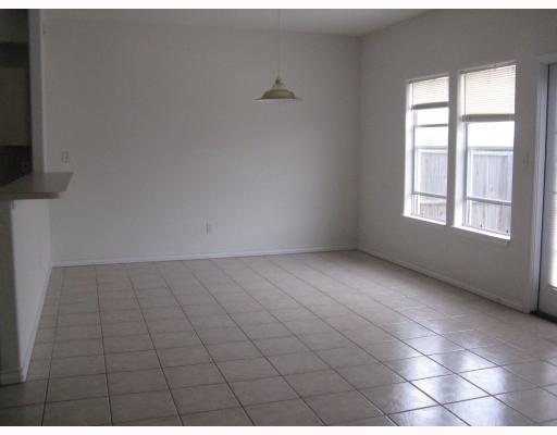 15514 Cruiser Street, Unit B Corpus Christi, TX 78418 - Photo 5 of 10 a view of an empty room with a window
