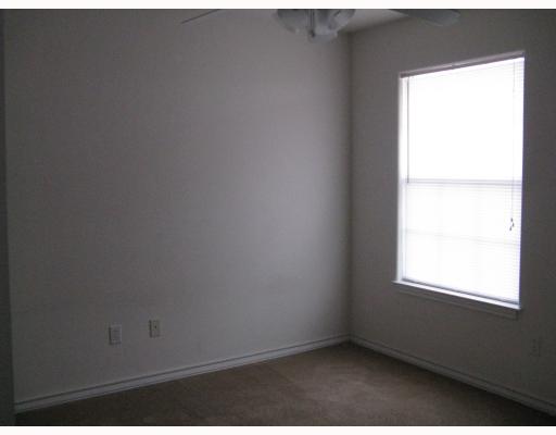 15514 Cruiser Street, Unit B Corpus Christi, TX 78418 - Photo 6 of 10 an empty room with a window