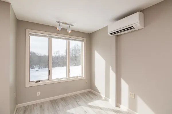 a view of an empty room with a window