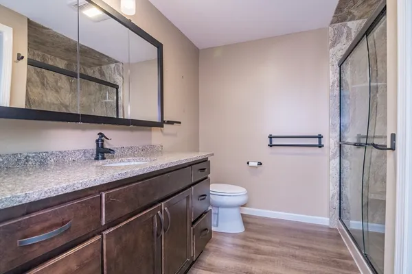 a view of bathroom with a sink and mirror