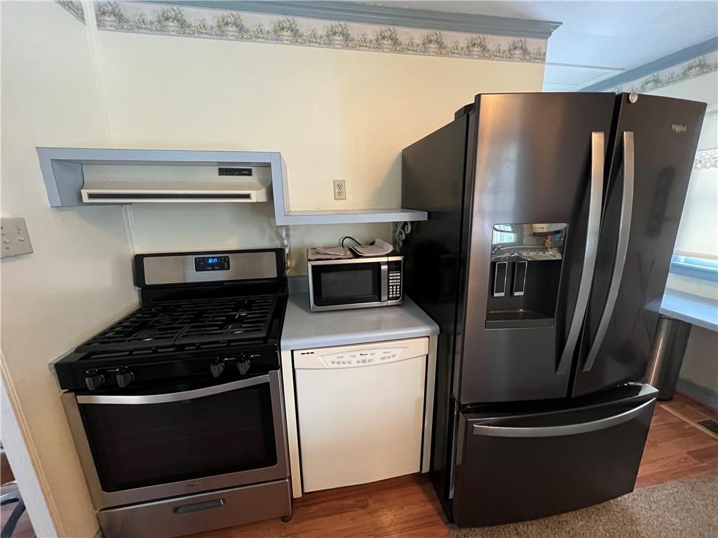 101 Filbert Road Butler, PA 16001 - Photo 11 of 37 a kitchen with stainless steel appliances granite countertop a stove and a refrigerator