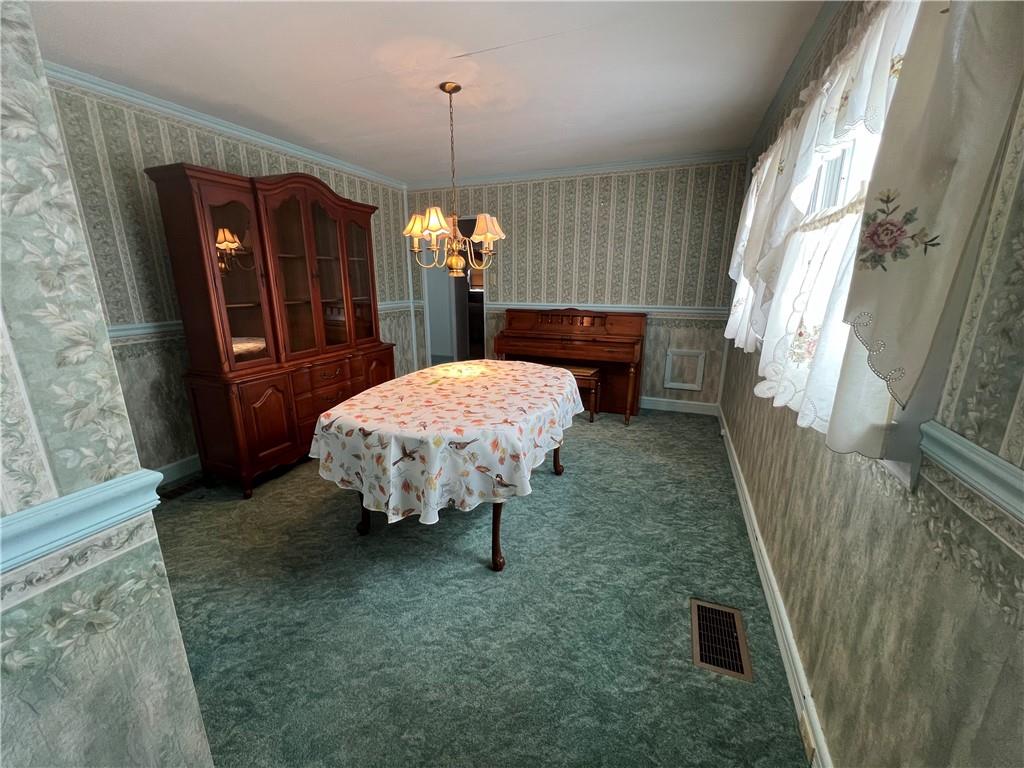 101 Filbert Road Butler, PA 16001 - Photo 15 of 37 a room with table and chandelier
