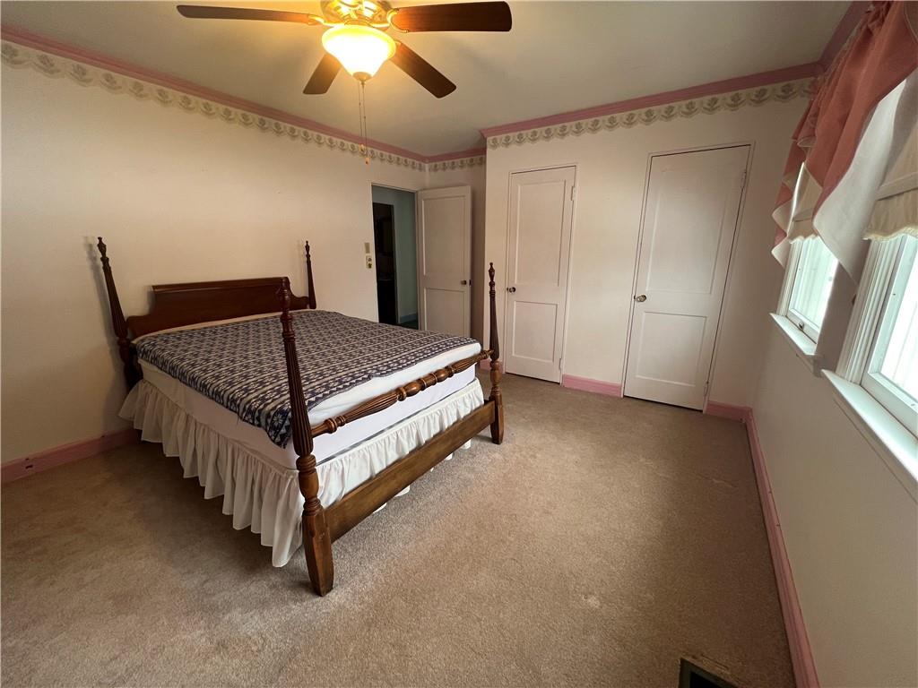 101 Filbert Road Butler, PA 16001 - Photo 21 of 37 a bed room with a bed and a chandelier