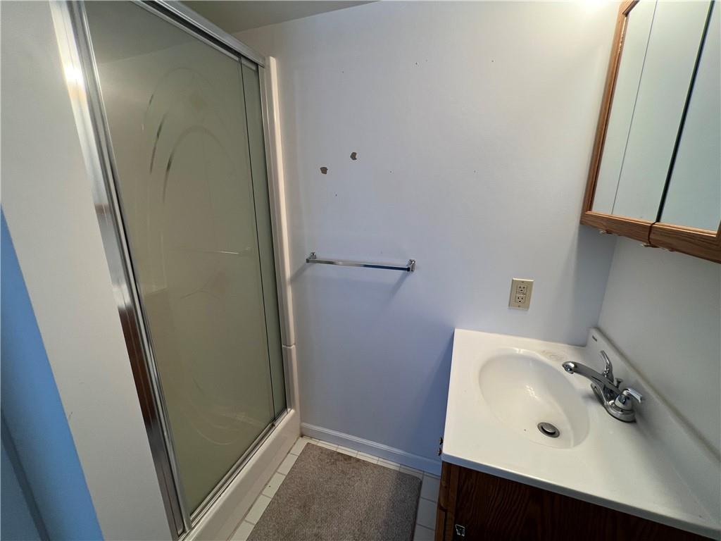 101 Filbert Road Butler, PA 16001 - Photo 35 of 37 a bathroom with a sink a mirror and shower