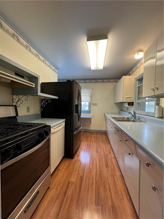 101 Filbert Road Butler, PA 16001 - Photo 7 of 37 a kitchen with wooden floors and appliances