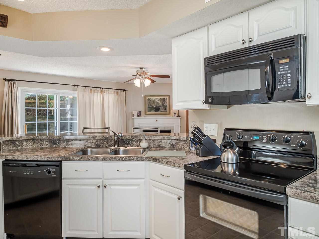 7746 Falcon Rest Circle, Unit 7746 Raleigh, NC 27615 - Photo 8 of 20 Stay in the conversation with family and friends while in the kitchen