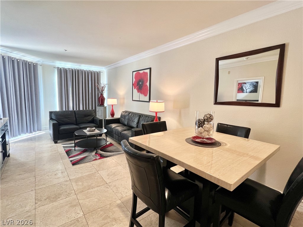 270 East Flamingo Road, Unit 313 Las Vegas, NV 89169 - Photo 2 of 27 Clean lines and a functional layout define this contemporary living and dining space.