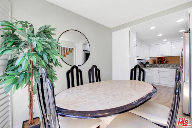 a view of a livingroom with furniture and mirror