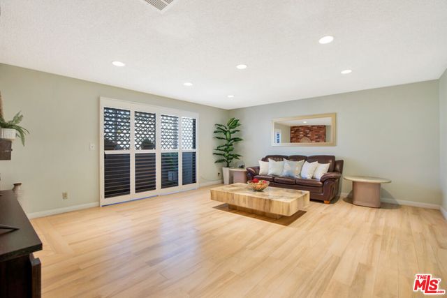 a spacious bedroom with a large bed and a couch