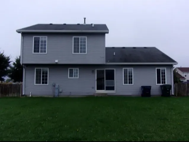 a house that has a big yard in front of it