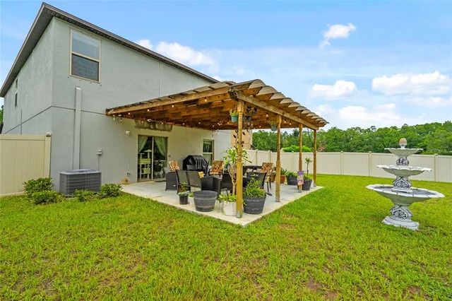 a big house with swimming pool in front of it