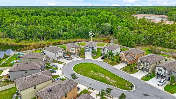 an aerial view of a house with a garden