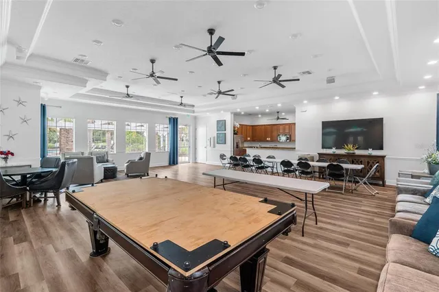 a large kitchen with a table and chairs