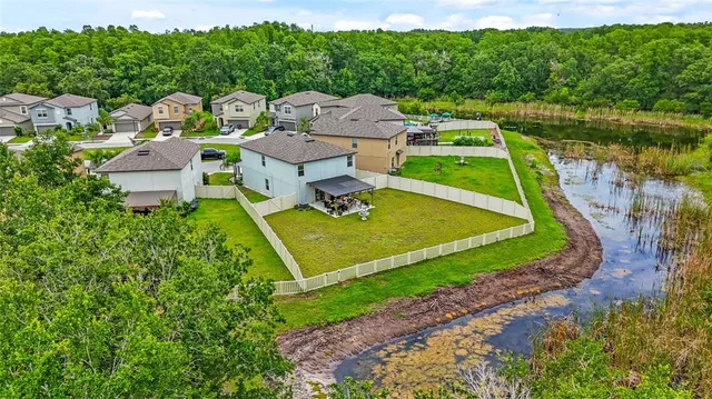 an aerial view of a house with pool