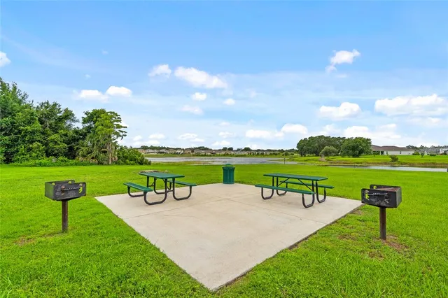 a view of a garden with an outdoor seating