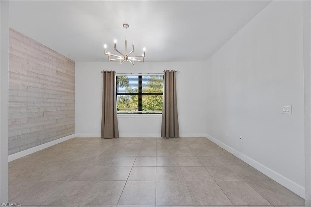 5845 Mayflower Way Ave Maria, FL 34142 - Photo 22 of 48 a view of an empty room with a window