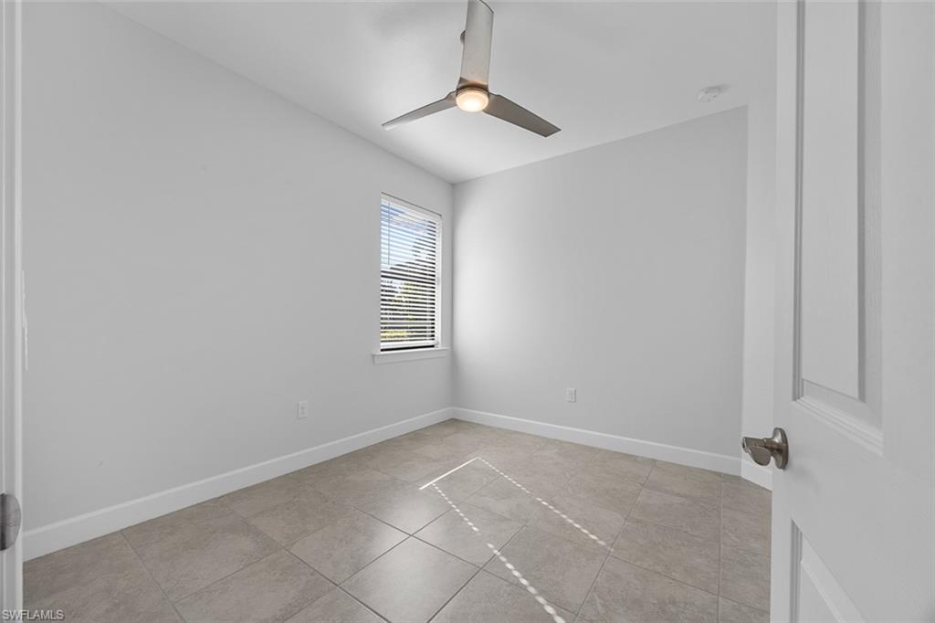 5845 Mayflower Way Ave Maria, FL 34142 - Photo 26 of 48 a view of an empty room with a window