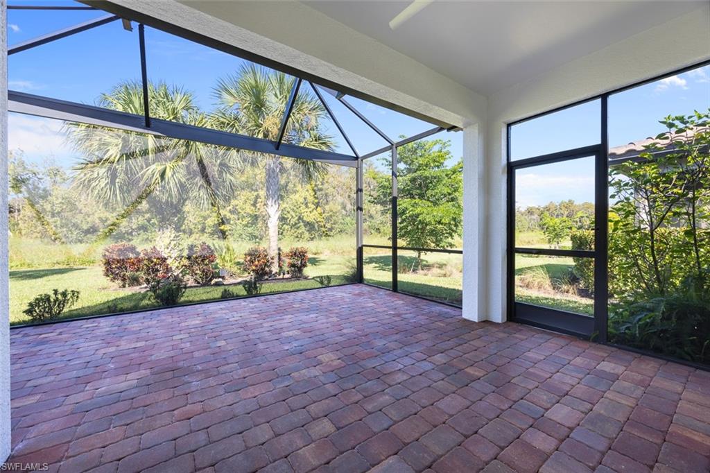 5845 Mayflower Way Ave Maria, FL 34142 - Photo 33 of 48 a view of a garden with an outdoor seating