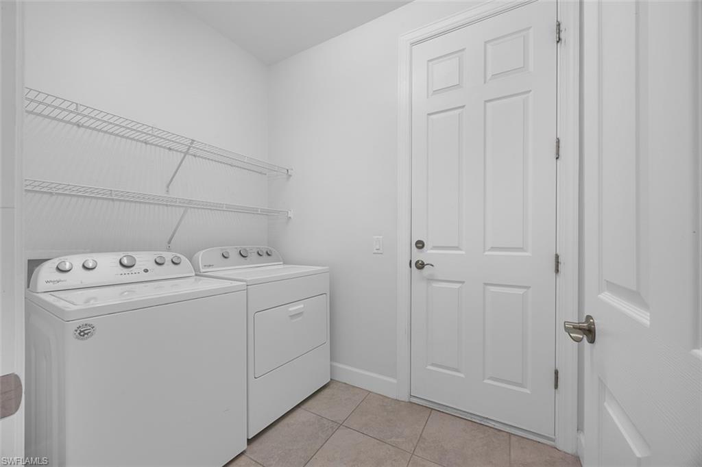 5845 Mayflower Way Ave Maria, FL 34142 - Photo 34 of 48 a utility room with dryer and washer
