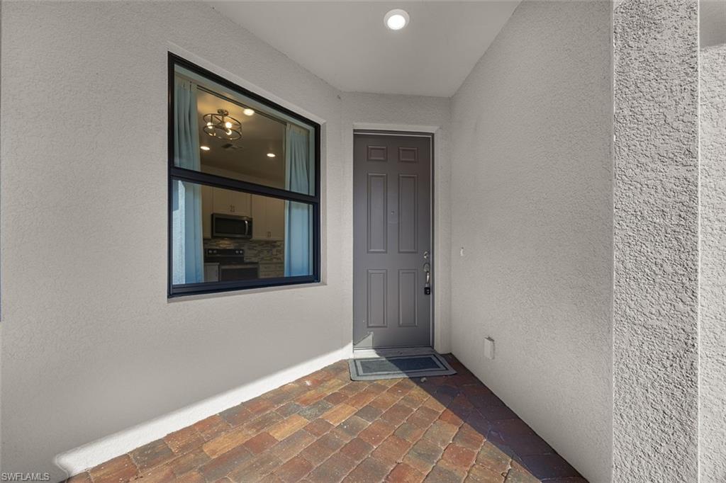 5845 Mayflower Way Ave Maria, FL 34142 - Photo 38 of 48 a view of an empty room with a window