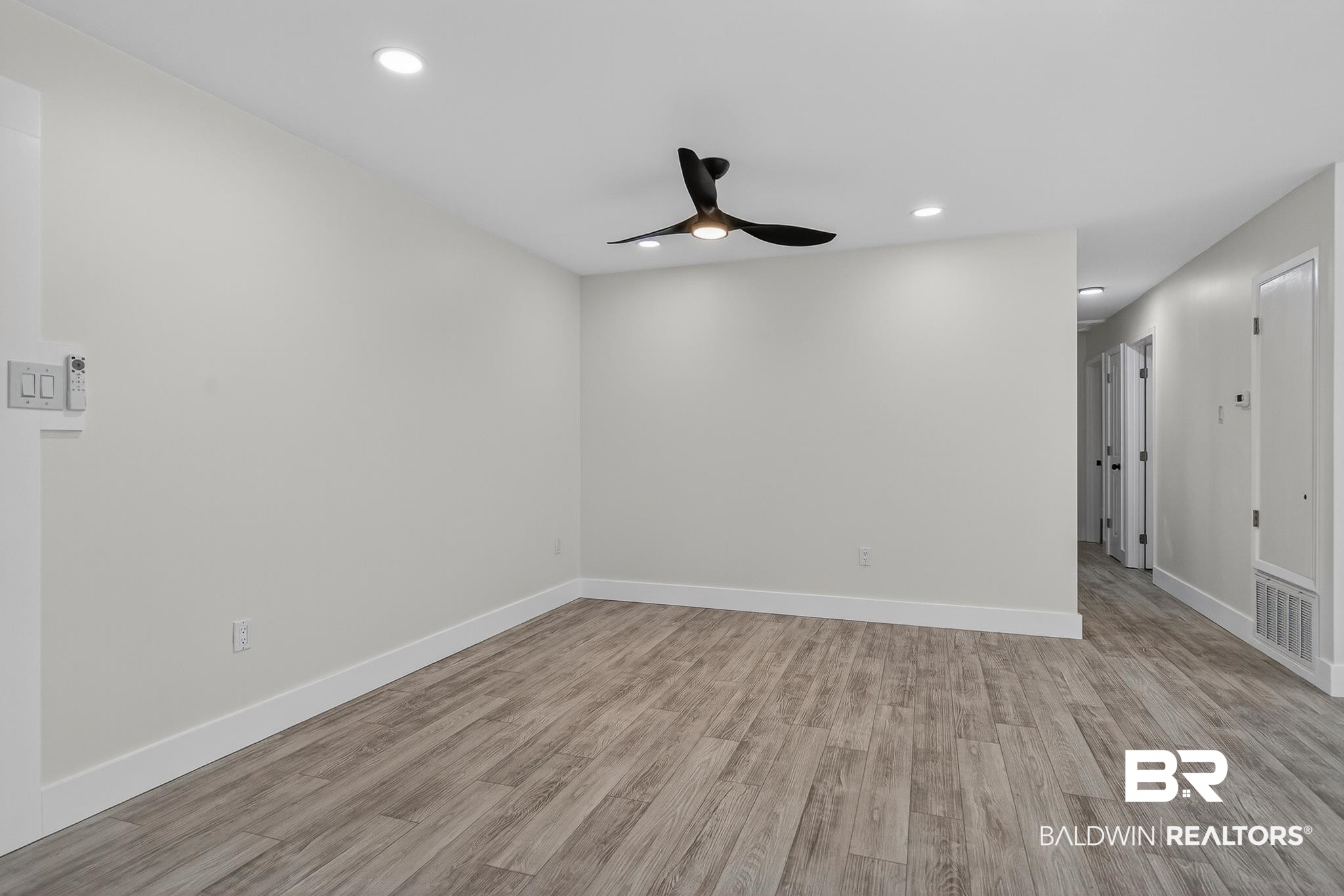 10650 Old Pascagoula Road Theodore, AL 36582 - Photo 31 of 77 Empty room with light wood-style floors, recessed lighting, and ceiling fan