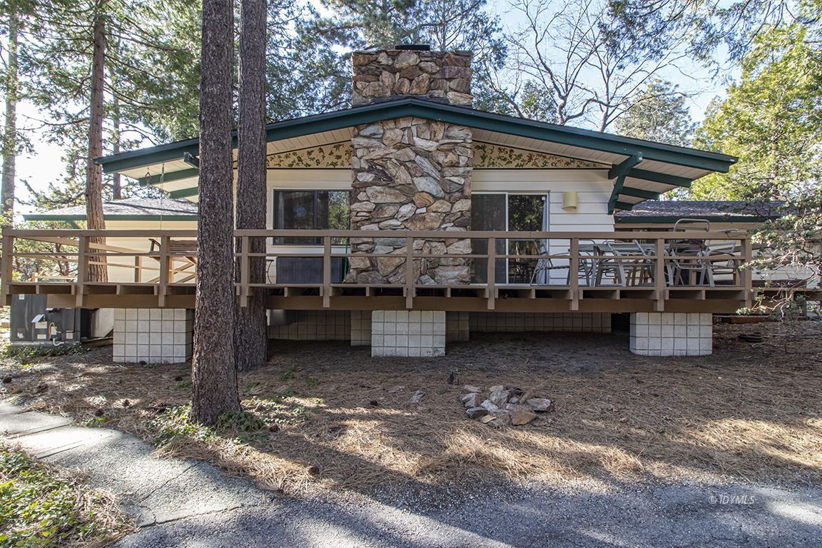 26890 Saunders Meadow Road Idyllwild, CA 92549 - Photo 8 of 44 a view of a house with backyard porch and sitting area