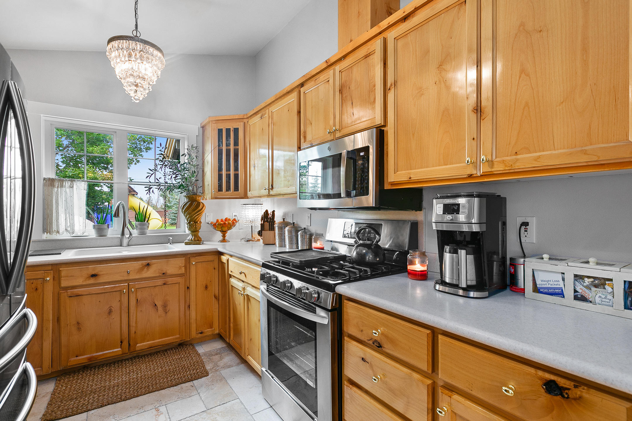 62672 Larkview Road Bend, OR 97701 - Photo 23 of 39 a kitchen with stainless steel appliances granite countertop a sink and cabinets