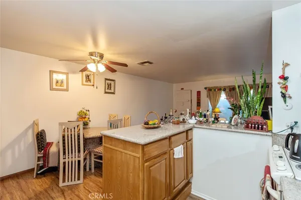 a kitchen that has a table and chairs in it
