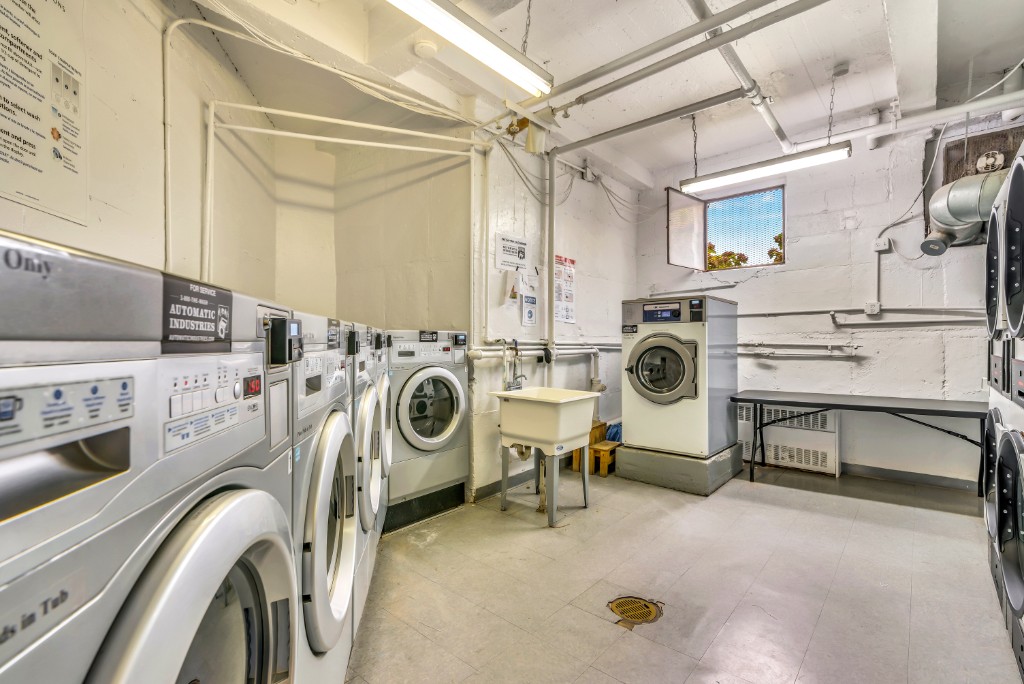 60-11 Broadway, Unit 3C Queens, NY 11377 - Photo 3 of 18 a utility room with dryer and washer