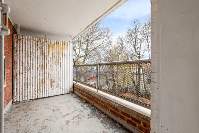 a bedroom with a bed and a stove top oven