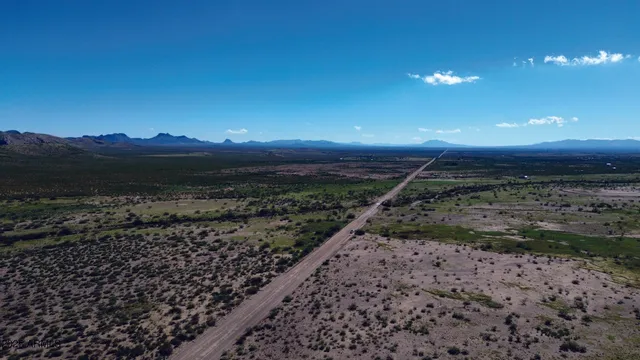 a view of a beach with a mountain in the background