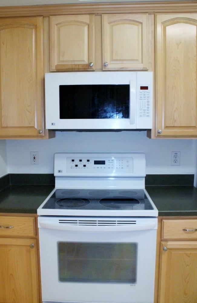 2219 Countryside Road Northwest Roanoke, VA 24017 - Photo 22 of 42 a stove top oven sitting inside of a kitchen
