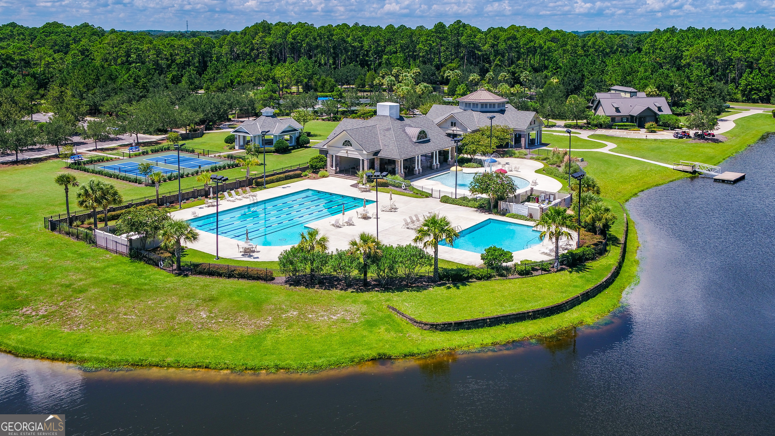 100 Amberjack Loop St. Marys, GA 31558 - Photo 11 of 16 a view of a swimming pool with a garden