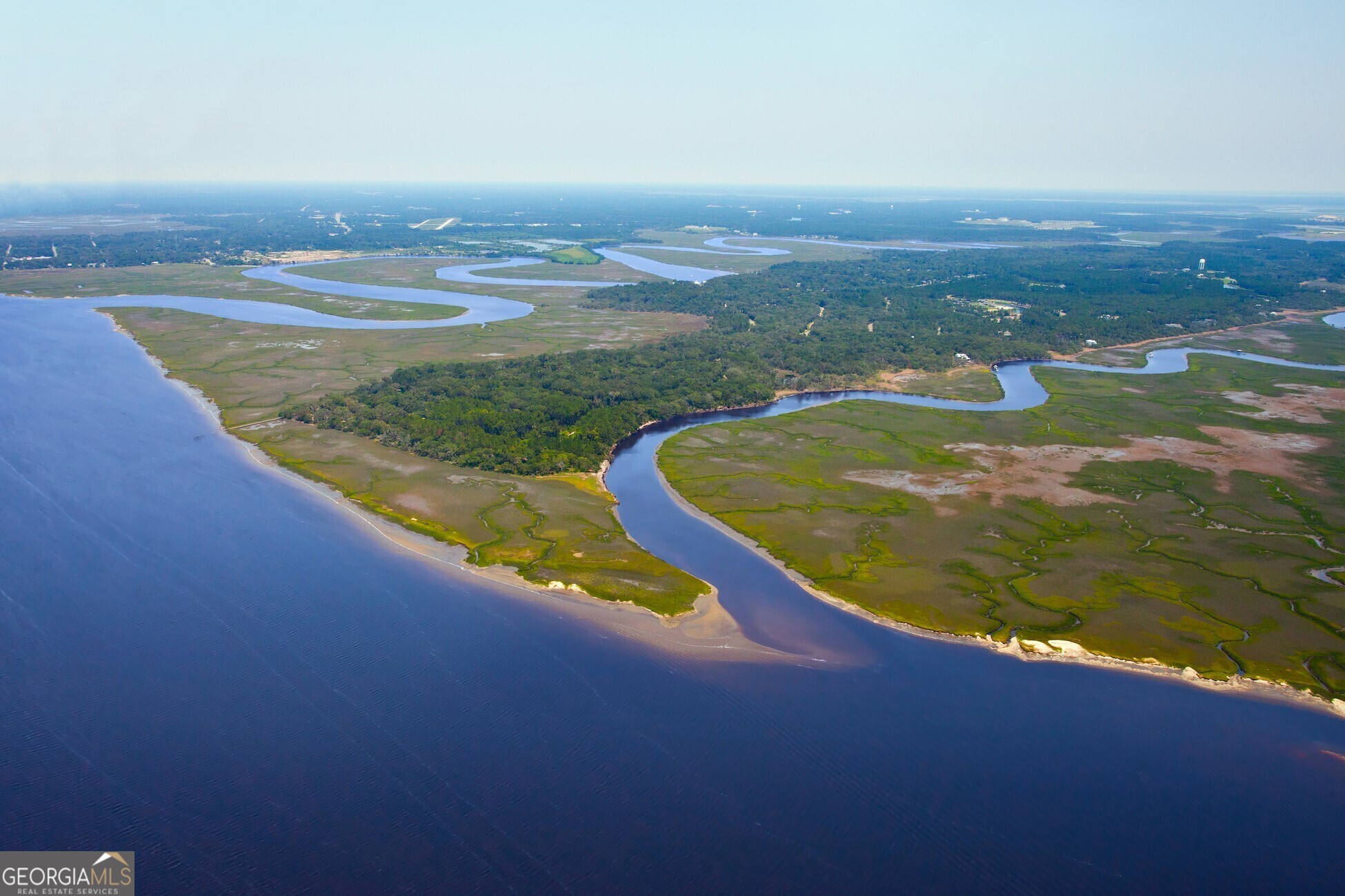 100 Amberjack Loop St. Marys, GA 31558 - Photo 2 of 16 an aerial view of ocean and residential houses with outdoor space